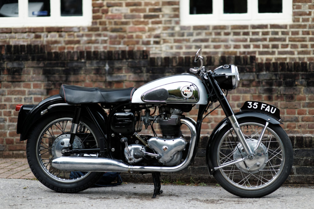 Motorcycle - norton - well maintained, against brick wall