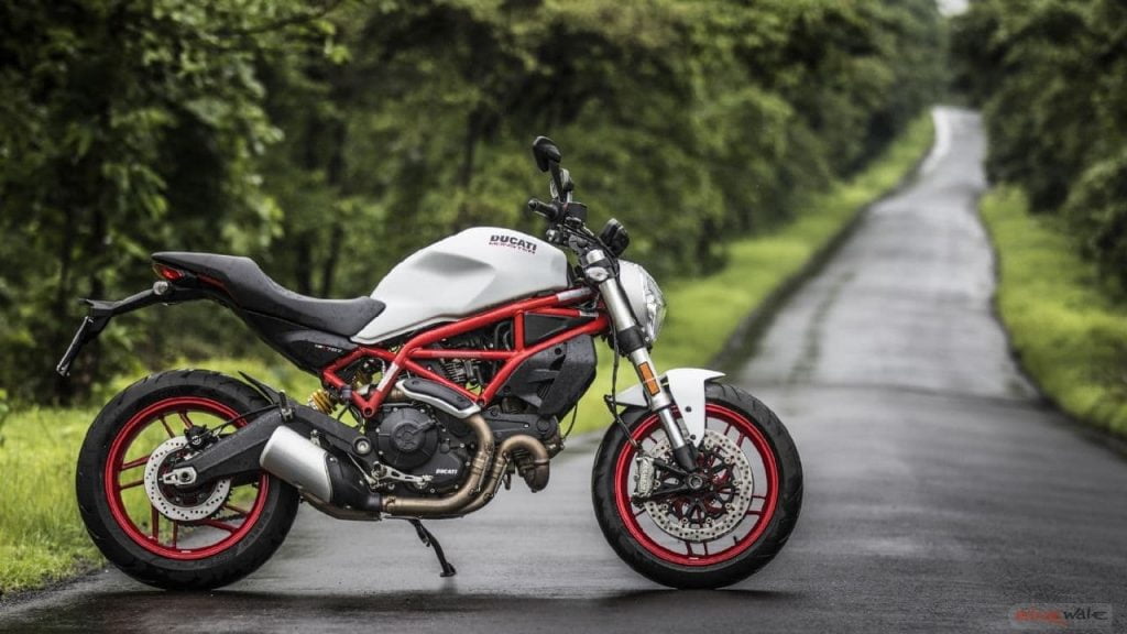 Ducati Monster 797 white RHS next to winding country lane
