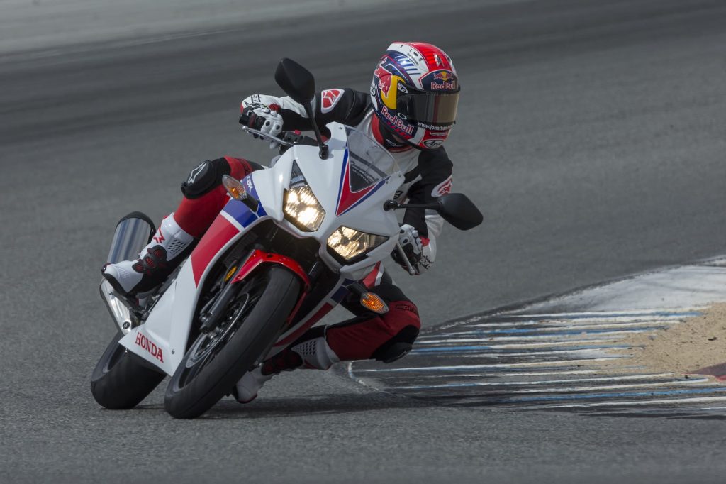 2015 Honda CBR300R riding around corner leaning