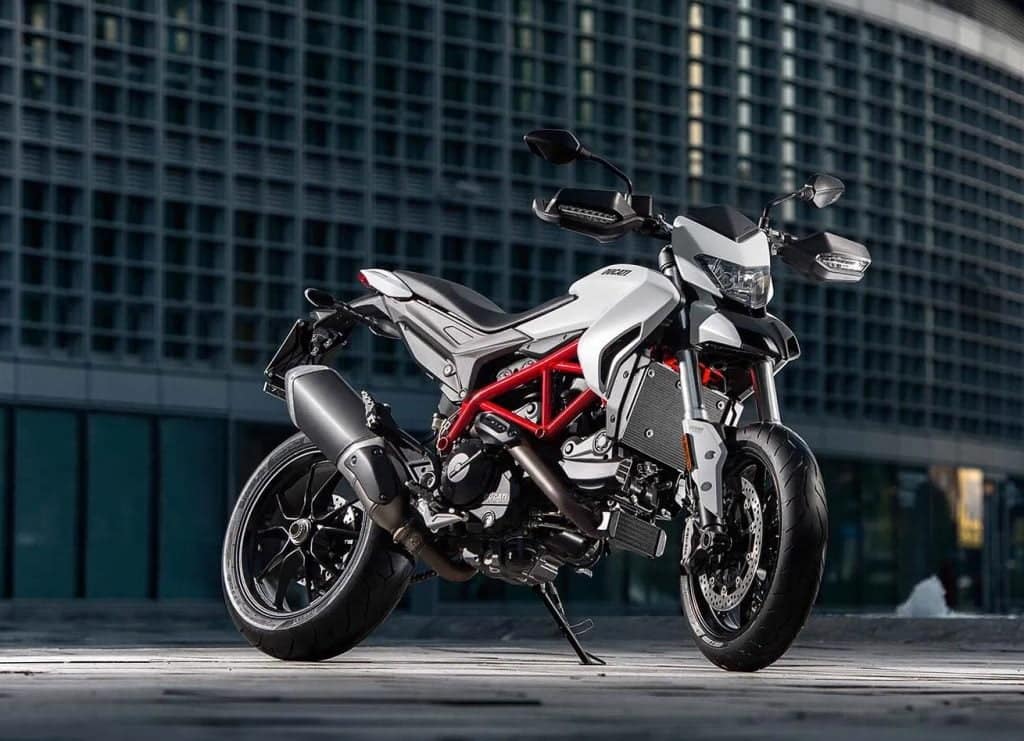 White Ducati Hypermotard 939, in front of building