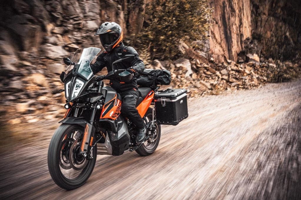 2021 KTM 890 Adventure - action shot outdoors dirt road full luggage LHS