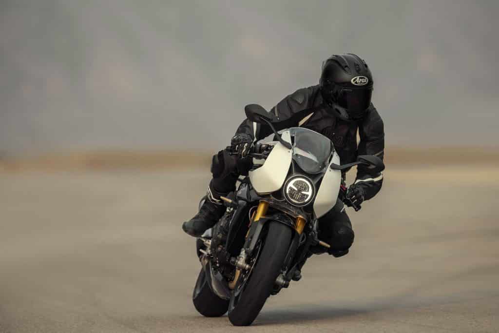2022 Triumph Speed Triple 1200 RR white riding leaning